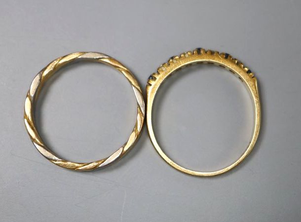 A modern 18ct gold, sapphire and diamond half hoop ring, size K and an 18ct two colour gold band, size J/K, gross 4.1 grams.